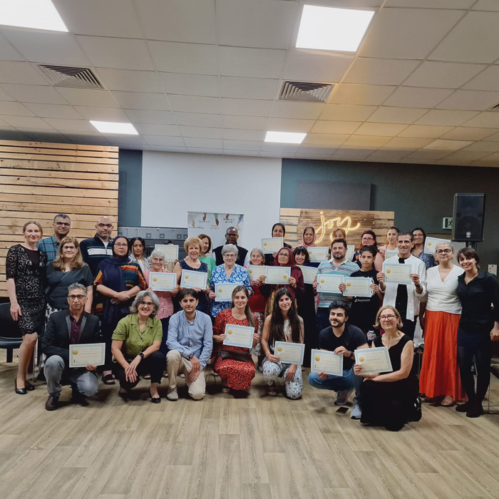 Group of volunteers holding their certificates